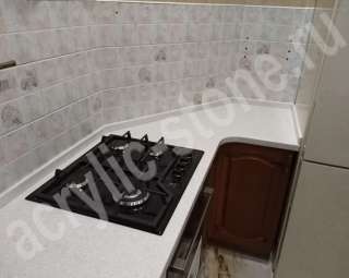 Фото Угловая столешница с оригинальной накладной мойкой из искусственного камня