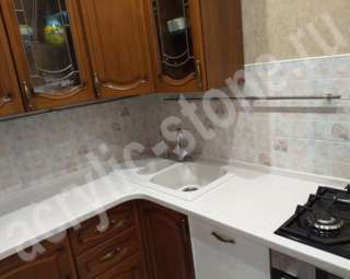Фото Угловая столешница с оригинальной накладной мойкой из искусственного камня